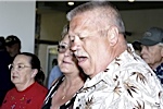 Verna Stine <i>(in background)</i>, Peggy and Tom Petersen