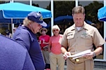 Bill Davis is being presented a certificate for riding the LCAC by Senior Chief Darin Campbell