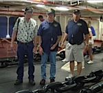 Marty Komarek, Mike Shults and Tony Motsco aboard the Midway in the anchor room