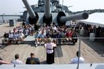 Memorial Service on board Battleship Massachusetts, Evelyn Calvin reading a poem from the podium