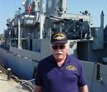 Jack Turley with USS Cassin Young in the background